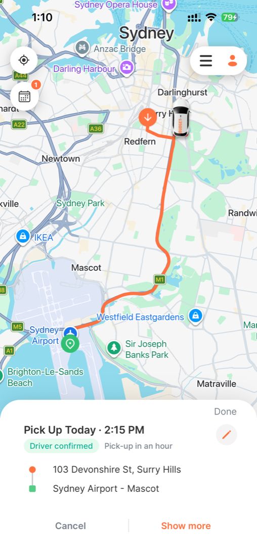 Scheduled ride tracking screen: a 'Pick Up Today 2:15 PM' card with a green 'Driver confirmed' badge and 'Pick-up in an hour', the pickup at 103 Devonshire St, Surry Hills and drop-off at Sydney Airport, and Cancel and Show more buttons. A calendar icon with a badge sits at the top-left.